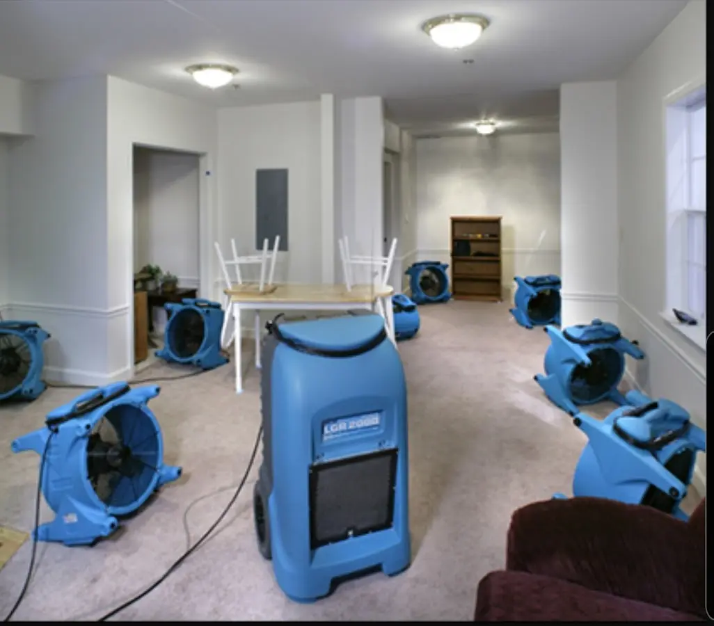 Air movers and dehumidifier setup for Water Damage Restoration in Melissa